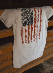 Cody James Patriotic Tee Shirt laying on a fence